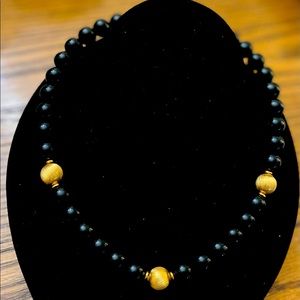 Napier 17 to 17-1/2” necklace with black and gold-tone beads.